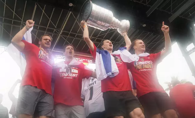 The Florida Panthers team celebrates their Stanley Cup victory over the Edmonton Oilers with an NHL hockey parade and rally Sunday, June 30, 2024, in Fort Lauderdale, Fla. (AP Photo/Marta Lavandier)