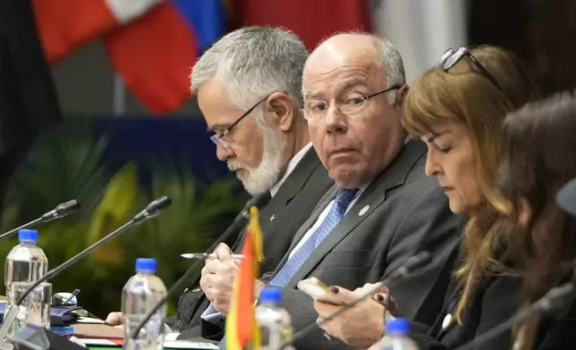 Brazil's Foreign Minister Mauro Vieira, center, attends a Mercosur summit session at the Port building in Asuncion, Paraguay, Sunday, July 7, 2024. Heads of state from South America's Mercosur trade bloc will gather in Asuncion on July 8. (AP Photo/Jorge Saenz)