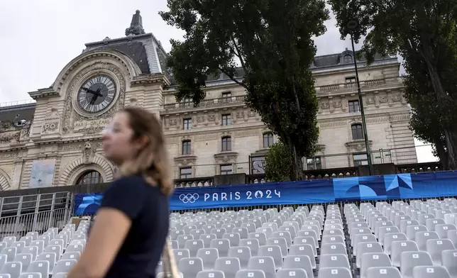 Spectator seats line the Seine river in front of the Musee d'Orsay ahead of the 2024 Summer Olympics, Wednesday, July 17, 2024, in Paris. Organizers have planned a parade of about 10,000 athletes through the heart of the French capital on boats on the Seine along a 6-kilometer (3.7-mile) route at sunset on July 26. (AP Photo/David Goldman)