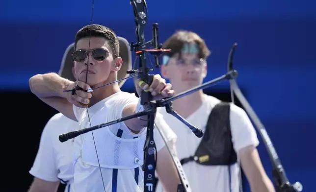 France's Thomas Chirault shoots during the men's team semifinals Archery competition against Turkey at the 2024 Summer Olympics, Monday, July 29, 2024, in Paris, France. (AP Photo/Rebecca Blackwell)