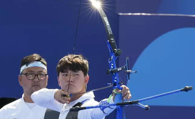 South Korea's Je Deok Kim shoots during the men's team semifinals Archery competition against China at the 2024 Summer Olympics, Monday, July 29, 2024, in Paris, France. (AP Photo/Rebecca Blackwell)