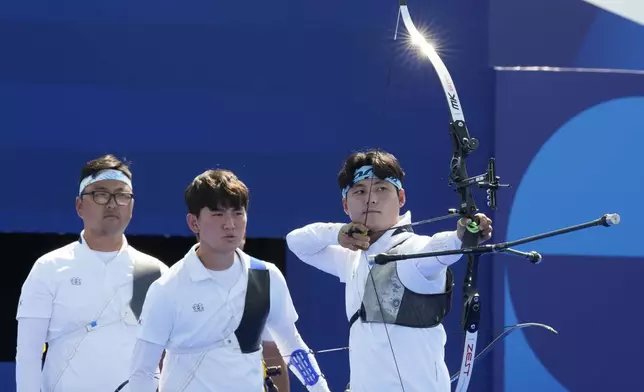 South Korea's Wooseok Lee shoots during the men's team semifinals Archery competition against China at the 2024 Summer Olympics, Monday, July 29, 2024, in Paris, France. (AP Photo/Rebecca Blackwell)