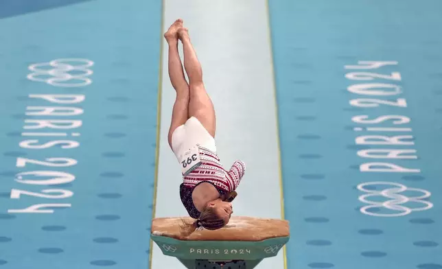 Jade Carey, of the United States, performs on the vault during the women's artistic gymnastics team finals round at Bercy Arena at the 2024 Summer Olympics, Tuesday, July 30, 2024, in Paris, France. (AP Photo/Francisco Seco)