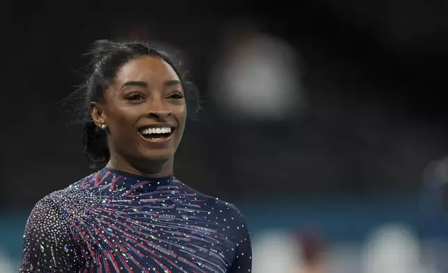 Simone Biles of the United States practices during a gymnastics training session at Bercy Arena at the 2024 Summer Olympics, Thursday, July 25, 2024, in Paris, France. (AP Photo/Francisco Seco)