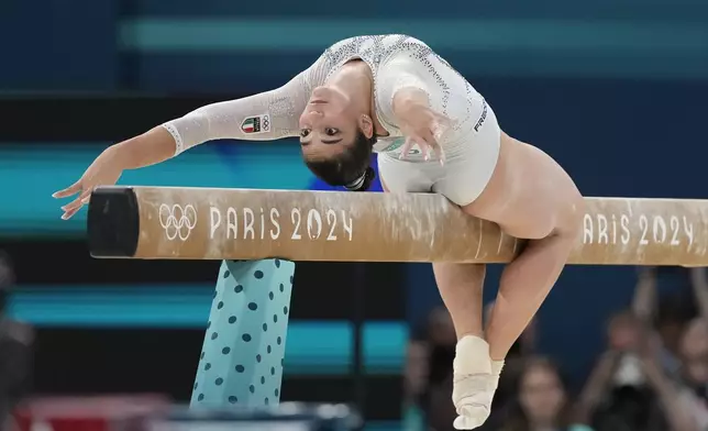 Manila Esposito, of Italy, performs on the balance beam during the women's artistic gymnastics team finals round at Bercy Arena at the 2024 Summer Olympics, Tuesday, July 30, 2024, in Paris, France. (AP Photo/Natacha Pisarenko)