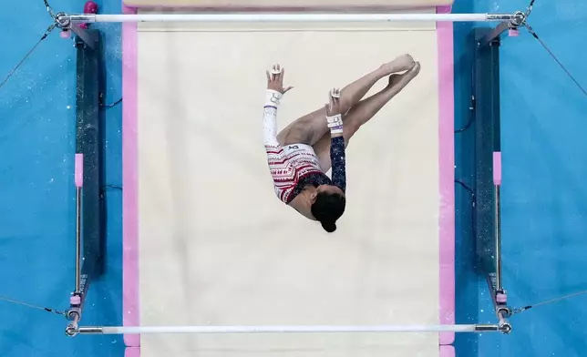 Sunisa Lee, of United States, performs on the uneven bars during the women's artistic gymnastics team finals at the 2024 Summer Olympics, Tuesday, July 30, 2024, in Paris, France. (AP Photo/Morry Gash)