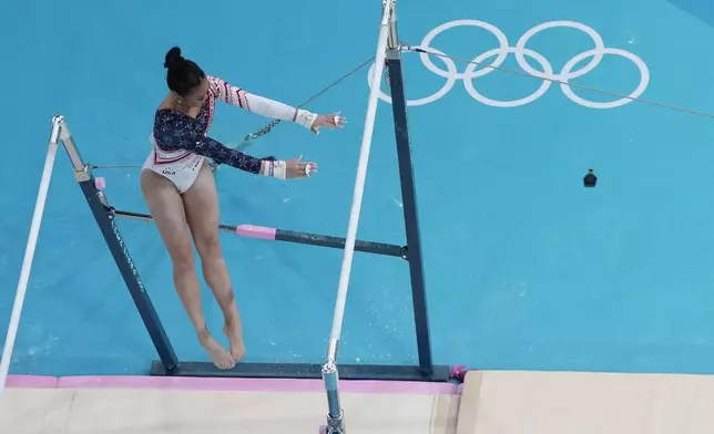 Sunisa Lee, of United States, performs on the uneven bars during the women's artistic gymnastics team finals at the 2024 Summer Olympics, Tuesday, July 30, 2024, in Paris, France. (AP Photo/Morry Gash)