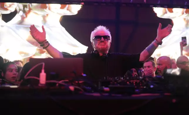 French musician Marc Cerrone performs during the DiscOlympics at Wanderlust night club at the 2024 Summer Olympics, Sunday, July 28, 2024, in Paris, France. (AP Photo/Natacha Pisarenko)