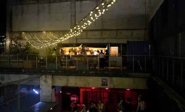 People attend the DiscOlympics at Wanderlust night club during the 2024 Summer Olympics, Sunday, July 28, 2024, in Paris, France. (AP Photo/Natacha Pisarenko)