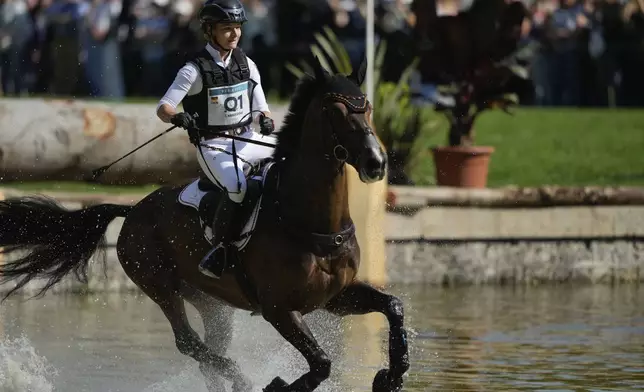 Germany's Julia Krajewski, riding Nickel 21, competes during the Equestrian Cross Country competition at Chateau de Versailles for the 2024 Summer Olympics, Sunday, July 28, 2024, in Versailles, France. (AP Photo/Mosa'ab Elshamy)