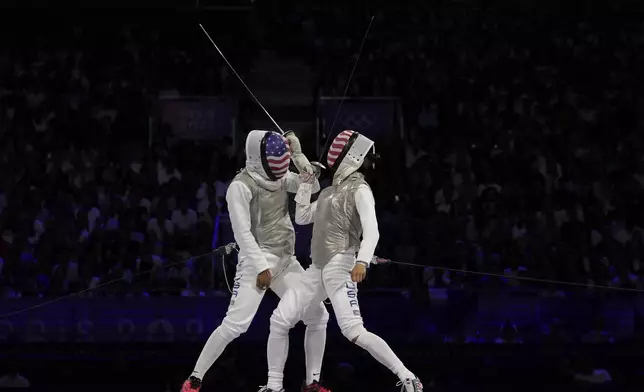 United States' Lee Kiefer, right, competes with United States' Lauren Scruggs in the women's individual Foil final match during the 2024 Summer Olympics at the Grand Palais, Sunday, July 28, 2024, in Paris, France. (AP Photo/Andrew Medichini)