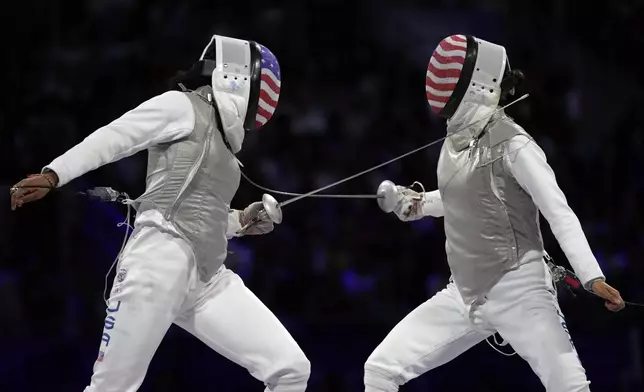 United States' Lee Kiefer, right, competes with United States' Lauren Scruggs in the women's individual Foil final match during the 2024 Summer Olympics at the Grand Palais, Sunday, July 28, 2024, in Paris, France. (AP Photo/Andrew Medichini)