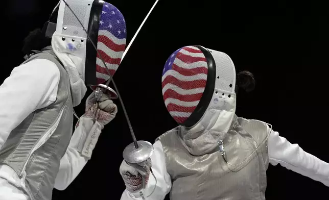 United States' Lee Kiefer, right, competes with United States' Lauren Scruggs in the women's individual Foil final match during the 2024 Summer Olympics at the Grand Palais, Sunday, July 28, 2024, in Paris, France. (AP Photo/Andrew Medichini)