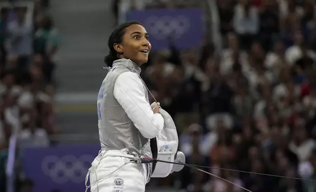 United States' Lauren Scruggs reacts after winning the women's individual Foil semifinal match against Canada's Eleanor Harvey during the 2024 Summer Olympics at the Grand Palais, Sunday, July 28, 2024, in Paris, France. (AP Photo/Andrew Medichini)