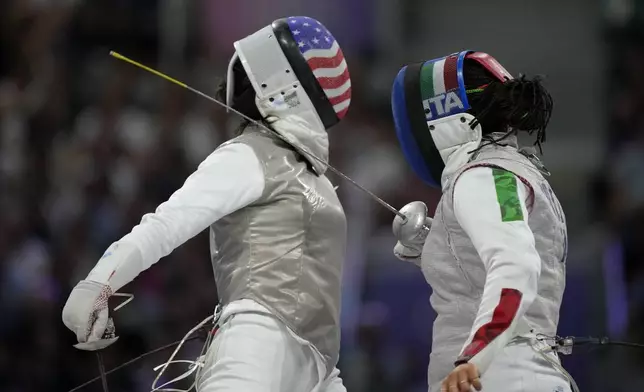 United States' Lee Kiefer, left, competes with Italy's Alice Volpi in the women's individual Foil semifinal match during the 2024 Summer Olympics at the Grand Palais, Sunday, July 28, 2024, in Paris, France. (AP Photo/Andrew Medichini)