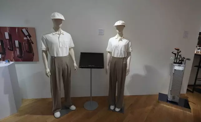 Outfits designed by French luxury brand LVMH to be worn by volunteers at Paris 2024 medals ceremonies, are displayed inside the LVMH Pavilion, showcasing LVMH creations related to the Paris 2024 Summer Olympics, Monday, July 22, 2024, in Paris. (AP Photo/Rebecca Blackwell)