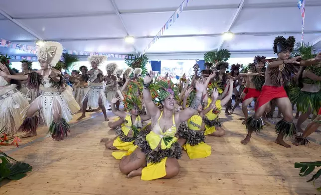 Dancers perform during an opening ceremony for the 2024 Summer Olympics surfing competition Friday, July 26, 2024, in Papara, Tahiti. (AP Photo/Gregory Bull)