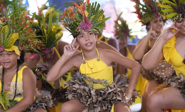 Dancers perform during an opening ceremony for the 2024 Summer Olympics surfing competition Friday, July 26, 2024, in Papara, Tahiti. (AP Photo/Gregory Bull)