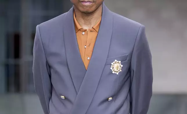 Pharrell Williams upon arrival at the Louis Vuitton Foundation on the eve of Paris Olympics opening ceremony, at the 2024 Summer Olympics, Thursday, July 25, 2024, in Paris, France. (AP Photo/Rebecca Blackwell)