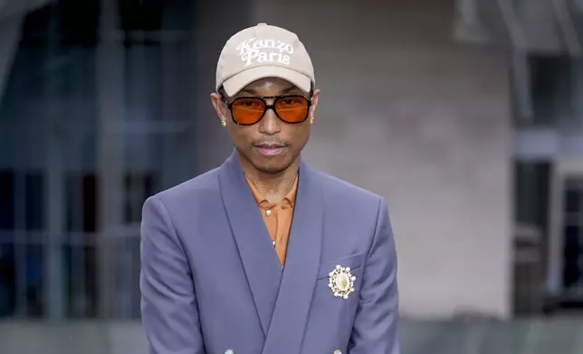 Pharrell Williams upon arrival at the Louis Vuitton Foundation on the eve of Paris Olympics opening ceremony, at the 2024 Summer Olympics, Thursday, July 25, 2024, in Paris, France. (AP Photo/Rebecca Blackwell)