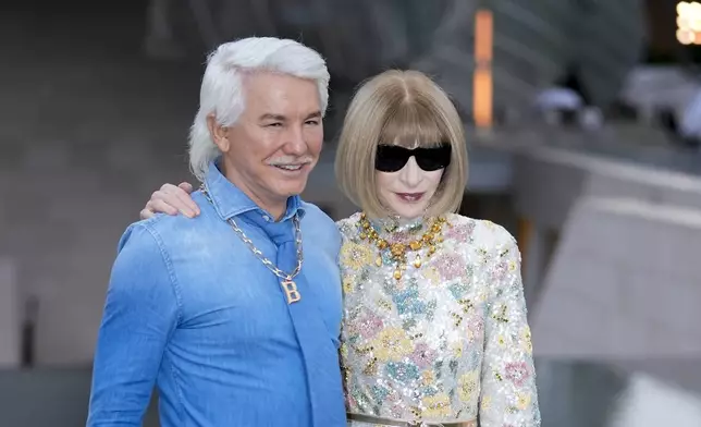 Baz Luhrmann, left, and Anna Wintour upon arrival at the Louis Vuitton Foundation on the eve of Paris Olympics opening ceremony, at the 2024 Summer Olympics, Thursday, July 25, 2024, in Paris, France. (AP Photo/Rebecca Blackwell)