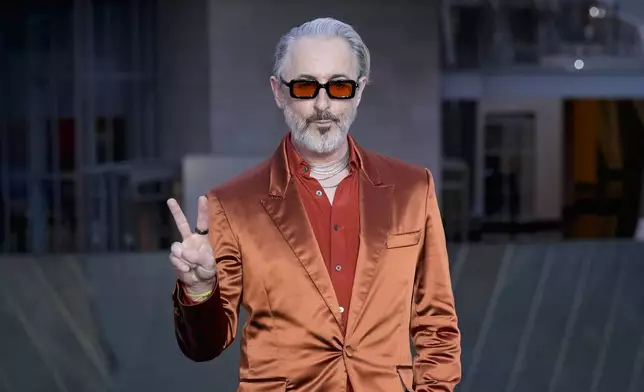 Alan Cumming upon arrival at the Louis Vuitton Foundation on the eve of Paris Olympics opening ceremony, at the 2024 Summer Olympics, Thursday, July 25, 2024, in Paris, France. (AP Photo/Rebecca Blackwell)