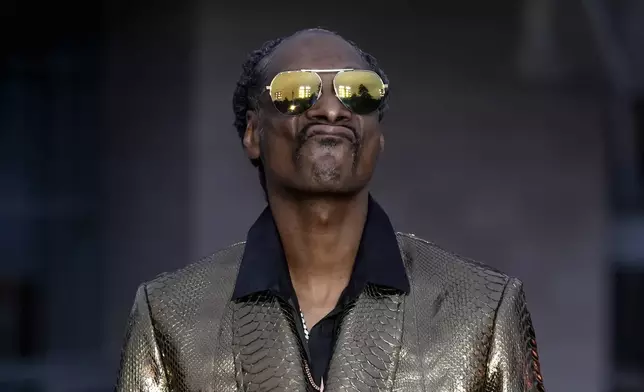 Snoop Dogg upon arrival at the Louis Vuitton Foundation on the eve of Paris Olympics opening ceremony, at the 2024 Summer Olympics, Thursday, July 25, 2024, in Paris, France. (AP Photo/Rebecca Blackwell)