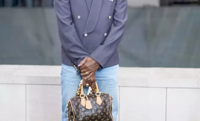 Pharrell Williams upon arrival at the Louis Vuitton Foundation on the eve of Paris Olympics opening ceremony, at the 2024 Summer Olympics, Thursday, July 25, 2024, in Paris, France. (AP Photo/Rebecca Blackwell)