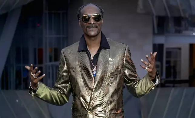 Snoop Dogg upon arrival at the Louis Vuitton Foundation on the eve of Paris Olympics opening ceremony, at the 2024 Summer Olympics, Thursday, July 25, 2024, in Paris, France. (AP Photo/Rebecca Blackwell)