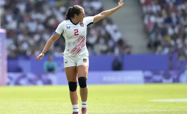 United States' Ilona Maher gestures to her teammates during the women's semifinal Rugby Sevens match between New Zealand and the United States at the 2024 Summer Olympics, in the Stade de France, in Saint-Denis, France, Tuesday, July 30, 2024. (AP Photo/Vadim Ghirda)