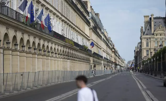 The Rivoli street is almost empty Thursday, July 18, 2024 in Paris. A special kind of iron curtain came down across central Paris on Thursday, with the beginning of an Olympic anti-terrorism perimeter along the banks of the River Seine sealing off a kilometers-long (miles-long) area to Parisians and tourists who hadn't applied in advance for a pass. (AP Photo/David Goldman)