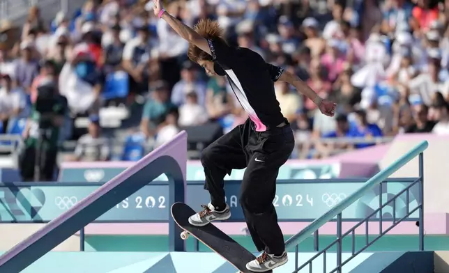 Yuto Horigome, of Japan, performs a trick during the men's skateboard street final at the 2024 Summer Olympics, Monday, July 29, 2024, in Paris, France. (AP Photo/Frank Franklin II)