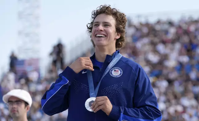 Jagger Eaton, of the United States, smiles after winning the silver medal in the men's skateboard street final at the 2024 Summer Olympics, Monday, July 29, 2024, in Paris, France. (AP Photo/Frank Franklin II)