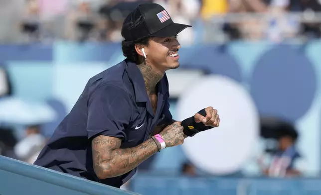 Nyjah Huston, of the United States, reacts during the men's skateboard street final at the 2024 Summer Olympics, Monday, July 29, 2024, in Paris, France. (AP Photo/Dar Yasin)