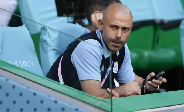 Argentina's coach Javier Mascherano sits on the bench prior to the Men's Group B soccer match between Argentina and Morocco at Geoffroy-Guichard Stadium during the 2024 Summer Olympics, Wednesday, July 24, 2024, in Saint-Etienne, France. (AP Photo/Silvia Izquierdo)