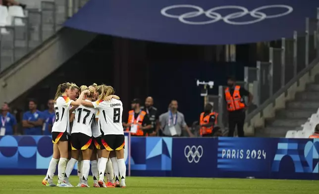 Germany celebrates their second goal scored by Lea Schueller during the women's Group B soccer match between Germany and Australia at the Velodrome stadium during the 2024 Summer Olympics, Thursday, July 25, 2024, in Marseille, France. (AP Photo/Daniel Cole)