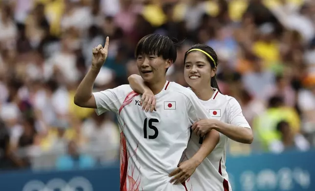 Japan's Aoba Fujino, foreground, celebrates after scoring, during the women's Group C match between Spain and Japan, at La Beaujoire Stadium, during the 2024 Summer Olympics Thursday, July 25, 2024, in Nantes, France. (AP Photo/Jeremias Gonzalez)