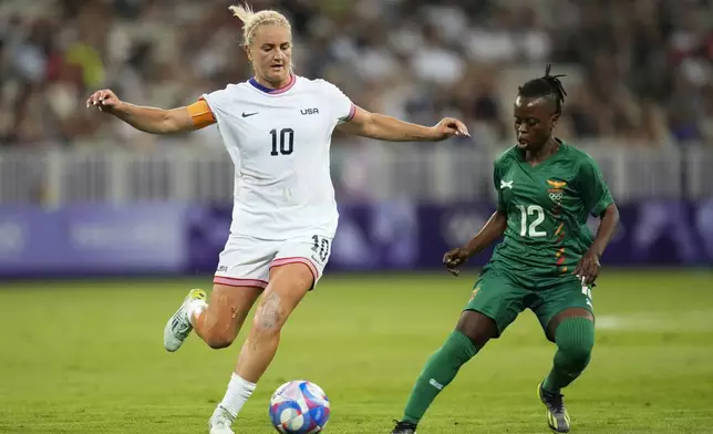 United States' Lindsey Horan, left, and Zambia's Avell Chitundu compete for the ball during a women's group B match between the United States and Zambia at Nice Stadium at the 2024 Summer Olympics, Thursday, July 25, 2024, in Nice, France. (AP Photo/Julio Cortez)