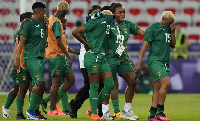 Zambia's players leave the pitch after losing 5-6 against Australia during a women's group B soccer match at the 2024 Summer Olympics, Sunday, July 28, 2024, in Nice, France. (AP Photo/Julio Cortez)