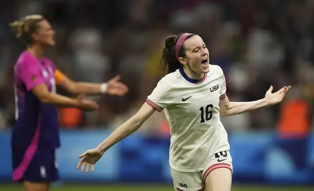 United States' Rose Lavelle celebrates after teammate Mallory Swanson scored their side's second goal, during the women's Group B soccer match between the United States and Germany at the Velodrome stadium, during the 2024 Summer Olympics, Sunday, July 28, 2024, in Marseille, France. (AP Photo/Daniel Cole)