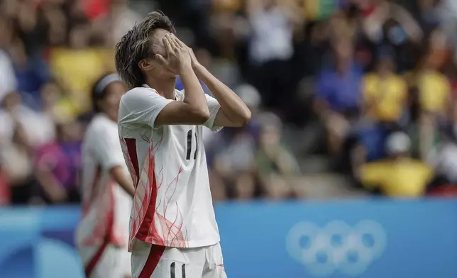 Japan's Tanaka Mina reacts during the women's group C match between Brazil and Japan at the Parc des Princes, during the 2024 Summer Olympics, Sunday, July 28, 2024, in Paris, France. (AP Photo/Aurelien Morissard)