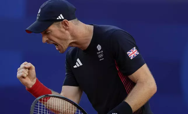 Andy Murray of Britain reacts after scoring a point against Kei Nishikori and Toro Daniel of Japan during the men's doubles tennis competition, at the 2024 Summer Olympics, Sunday, July 28, 2024, in Paris, France. (AP Photo/Andy Wong)