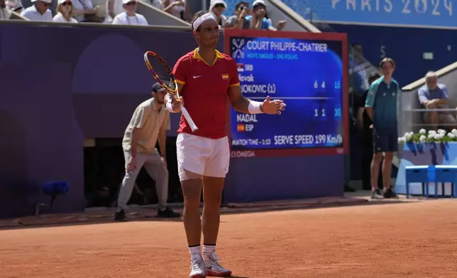 Spain's Rafael Nadal reacts as he plays Serbia's Novak Djokovic during their men's singles second round match at the 2024 Summer Olympics, Monday, July 29, 2024, at the Roland Garros stadium in Paris, France. (AP Photo/Andy Wong)