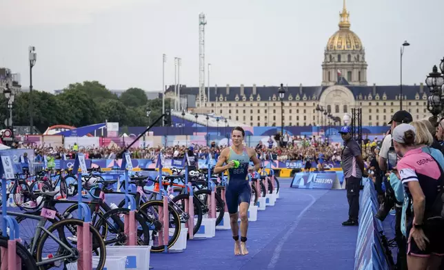 Flora Duffy, of Bermuda, competes during the women's individual triathlon competition at the 2024 Summer Olympics, Wednesday, July 31, 2024, in Paris, France. (AP Photo/Dar Yasin)