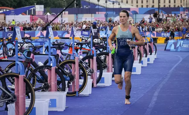 Flora Duffy, of Bermuda, competes during the women's individual triathlon competition at the 2024 Summer Olympics, Wednesday, July 31, 2024, in Paris, France. (AP Photo/Dar Yasin)