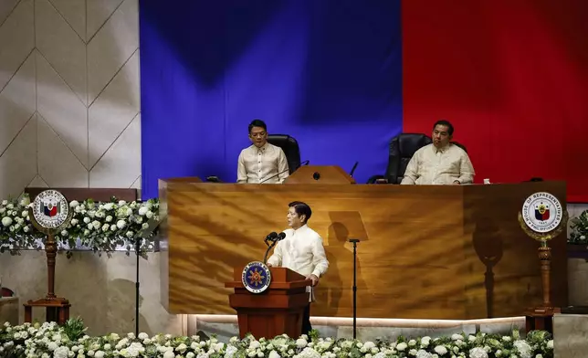 Philippine President Ferdinand Marcos Jr. delivers his third State of the Nation Address as Senate President Francis Escudero, left and House Speaker Martin Romualdez, right, look on at the House of Representatives in Quezon City, Philippines, on Monday, July 22, 2024. (AP Photo/ Gerard V. Carreon)