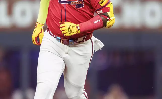 Atlanta Braves' designated hitter Marcell Ozuna rounds second base after a three-run home run in the eighth inning of a baseball game against the Philadelphia Phillies, Friday, July 5, 2024, in Atlanta. (AP Photo/Jason Allen)