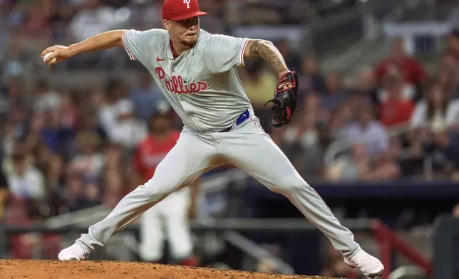 Philadelphia Phillies' pitcher Orion Kerkering throws in the eighth inning of a baseball game against the Atlanta Braves, Friday, July 5, 2024, in Atlanta. (AP Photo/Jason Allen)