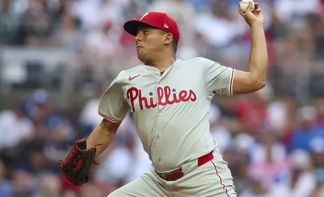 Philadelphia Phillies starting pitcher Ranger Suarez delivers in the first inning of a baseball game against the Atlanta Braves, Saturday, July 6, 2024, in Atlanta. (AP Photo/Brett Davis)