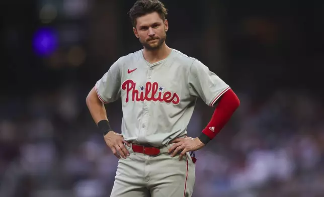 Philadelphia Phillies' Trea Turner reacts after being left on base in the third inning of a baseball game against the Atlanta Braves, Saturday, July 6, 2024, in Atlanta. (AP Photo/Brett Davis)